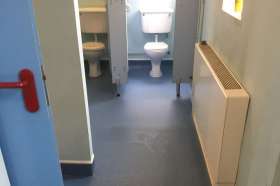 The vinyl flooring we installed in the men's community toilet block.
