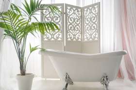 A bathroom that could benefit from palm print and natural flooring.