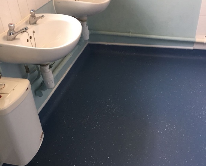 Another view of the flooring we installed in the community toilets.