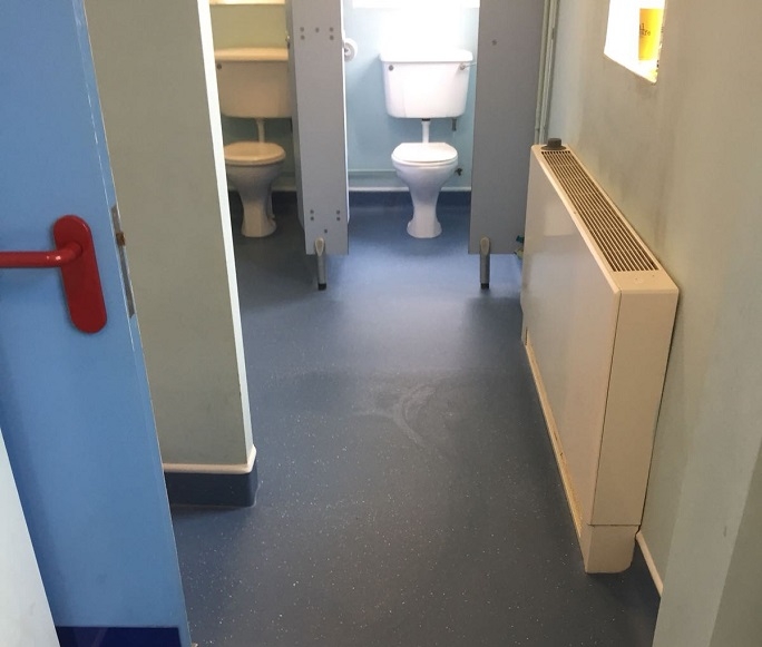 The vinyl flooring we installed in the men's community toilet block.