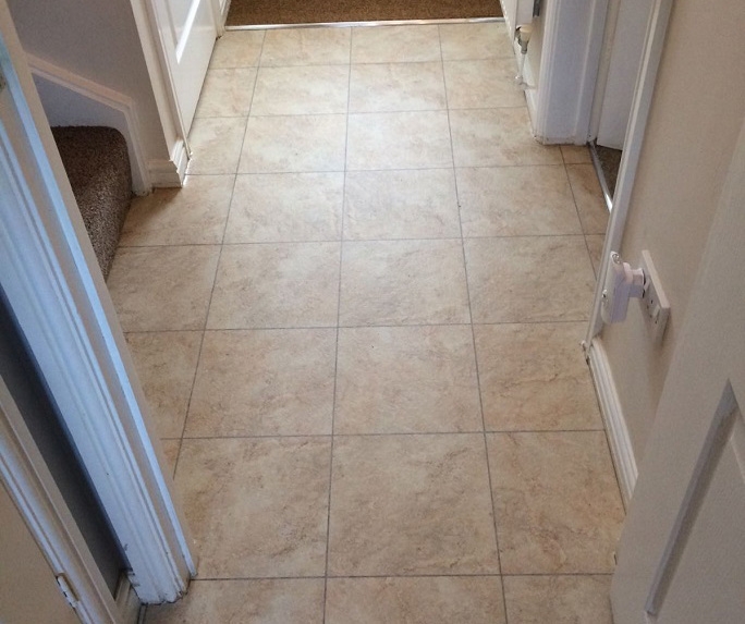 The vinyl floor tiles in the hallway of the property.