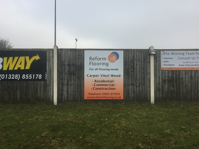 Reform Flooring's advertising board at Fakenham Football Club