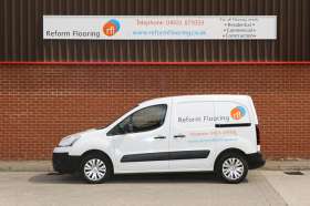 Reform Flooring van parked outside showroom